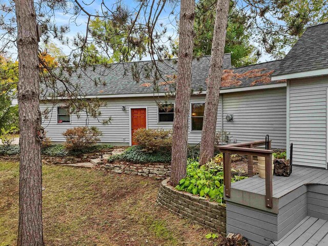 320 Marble St, Cadillac, MI 49601 - back of property with a deck and roof with shingles
