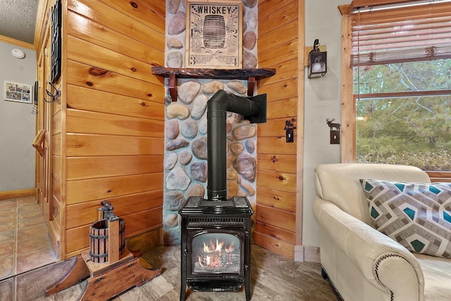 320 Marble St, Cadillac, MI 49601 - living area with baseboards, a wood stove, and crown molding