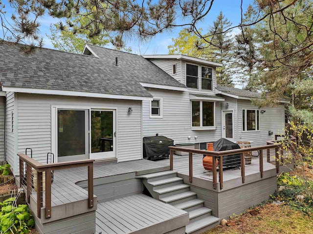 320 Marble St, Cadillac, MI 49601 - back of property featuring roof with shingles and a wooden deck