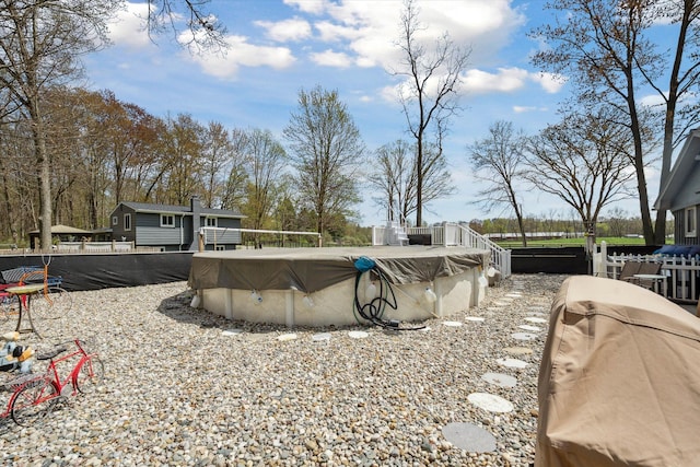 view of swimming pool featuring a fenced in pool