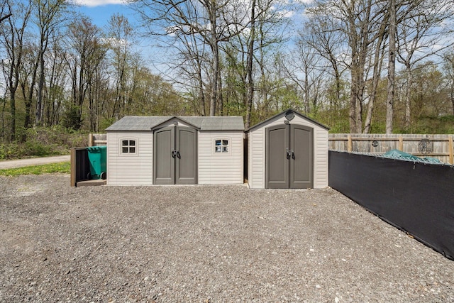 view of shed with fence