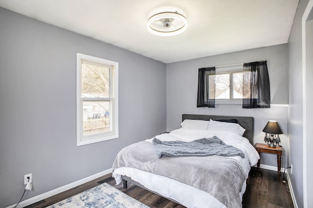 322 Astor Ave, Lansing, MI 48910 - bedroom featuring baseboards and wood finished floors