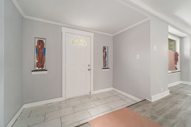 16140 Monte Vista St, Detroit, MI 48221 - entrance foyer featuring baseboards, marble look tiles, ornamental molding, and plenty of natural light