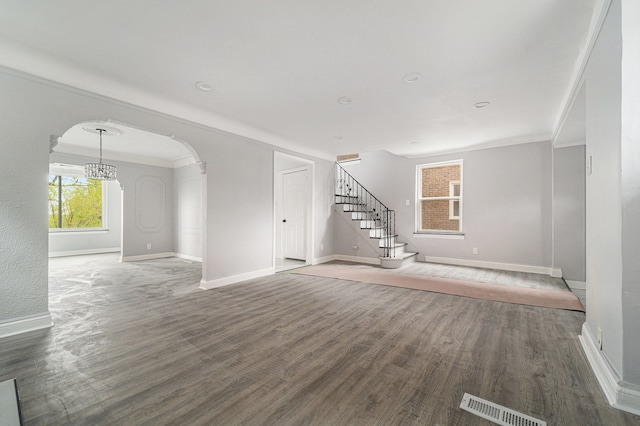 16140 Monte Vista St, Detroit, MI 48221 - unfurnished living room with stairs, wood finished floors, baseboards, and ornamental molding