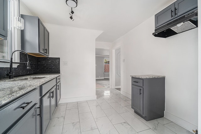 16140 Monte Vista St, Detroit, MI 48221 - kitchen with a sink, light marble finish flooring, and baseboards