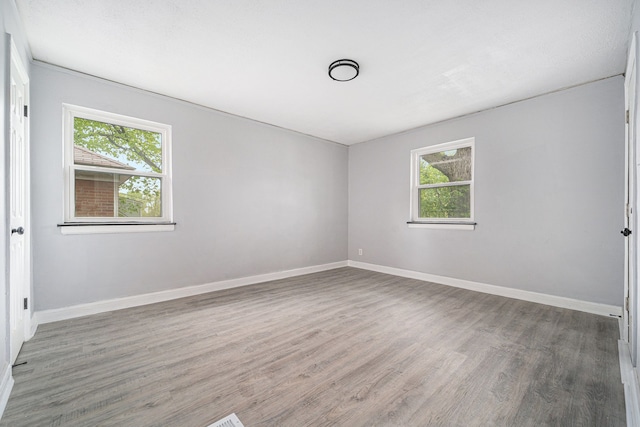 16140 Monte Vista St, Detroit, MI 48221 - unfurnished room with healthy amount of natural light, wood finished floors, and baseboards