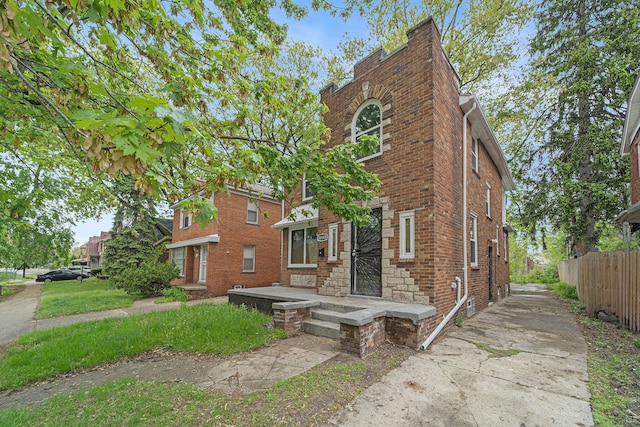 16140 Monte Vista St, Detroit, MI 48221 - view of front facade featuring fence and brick siding