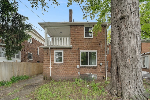 16140 Monte Vista St, Detroit, MI 48221 - rear view of property featuring fence, a balcony, and brick siding