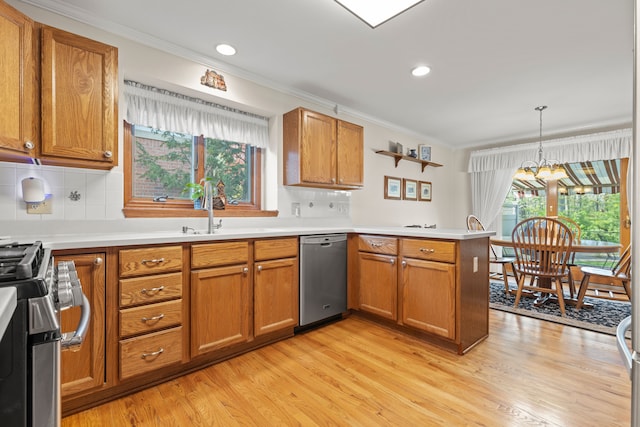 kitchen with ornamental molding, a peninsula, brown cabinets, a sink, and stainless steel appliances