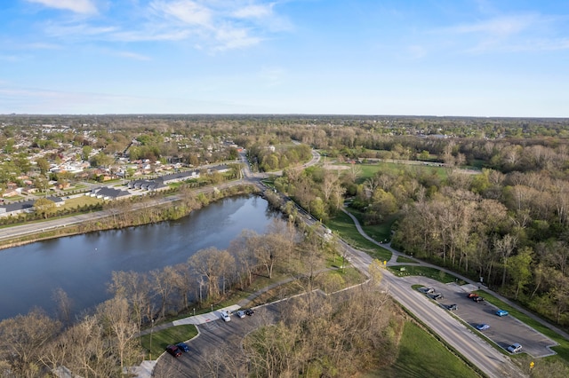 bird's eye view featuring a view of trees and a water view