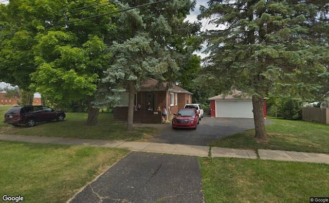 182 Summit St, Pontiac, MI 48342 - view of front of property with a garage, a front lawn, and an outbuilding