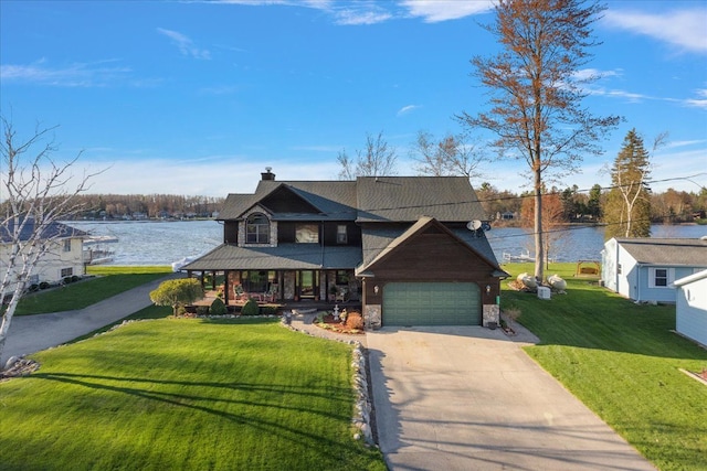 craftsman-style home featuring a front lawn, stone siding, a porch, a water view, and driveway