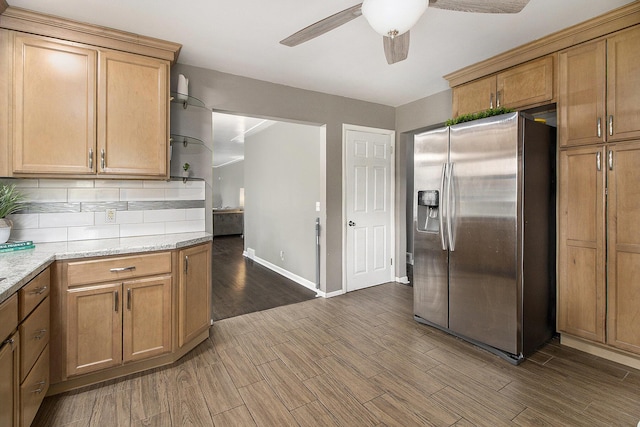 kitchen featuring stainless steel fridge, a ceiling fan, baseboards, decorative backsplash, and dark wood-style floors
