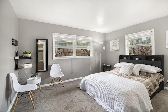 carpeted bedroom with baseboards