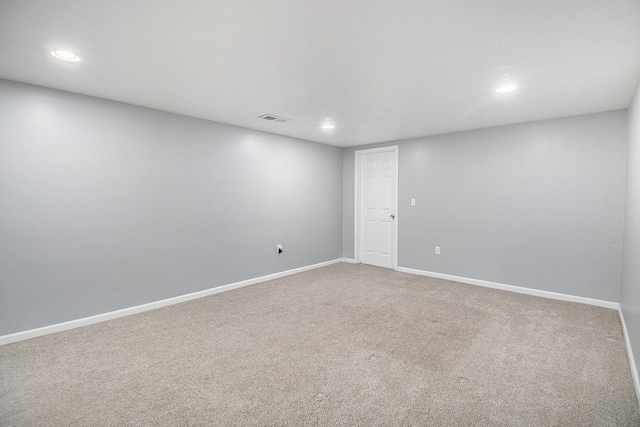 carpeted empty room with recessed lighting, baseboards, and visible vents