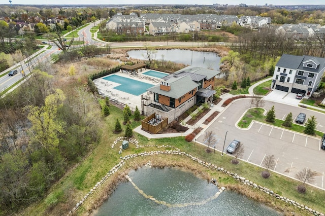bird's eye view featuring a water view and a residential view