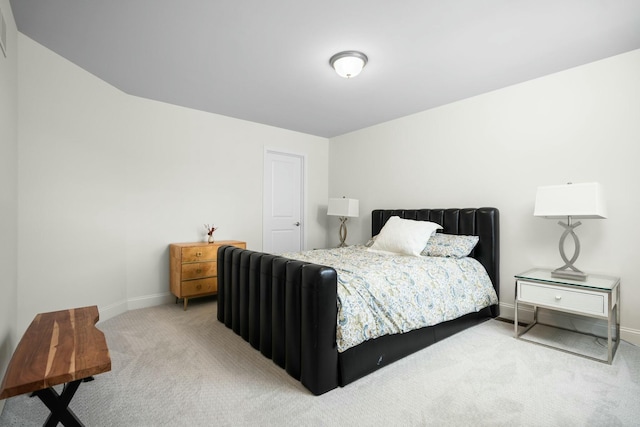 carpeted bedroom with baseboards
