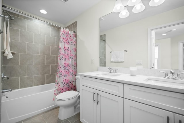 full bath featuring shower / bath combination with curtain, tile patterned flooring, double vanity, and a sink