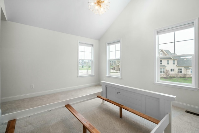 interior space featuring an inviting chandelier, light carpet, baseboards, visible vents, and high vaulted ceiling