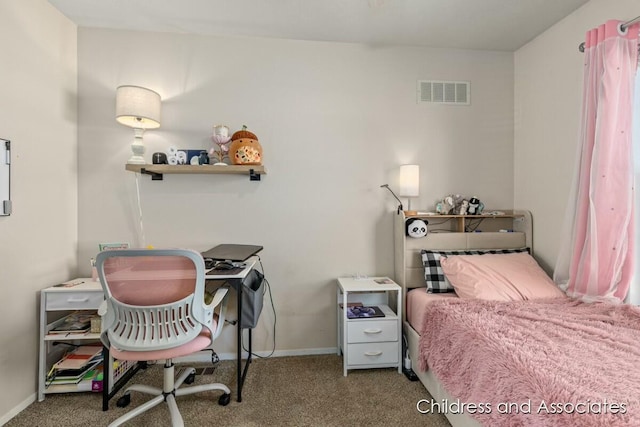 carpeted bedroom featuring baseboards and visible vents
