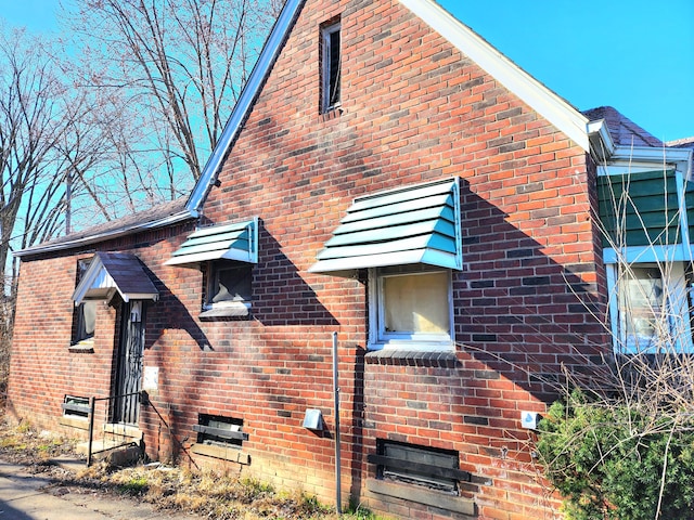 view of home's exterior with brick siding