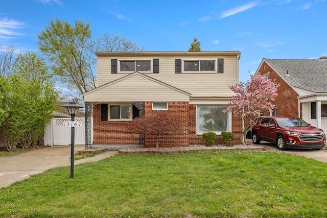 15167 Keppen Ave, Allen Park, MI 48101 - traditional home with brick siding, a front yard, and concrete driveway