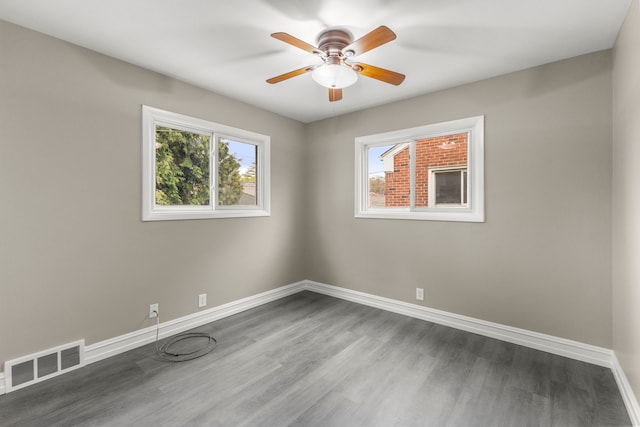 15167 Keppen Ave, Allen Park, MI 48101 - unfurnished room with a ceiling fan, baseboards, visible vents, and dark wood finished floors