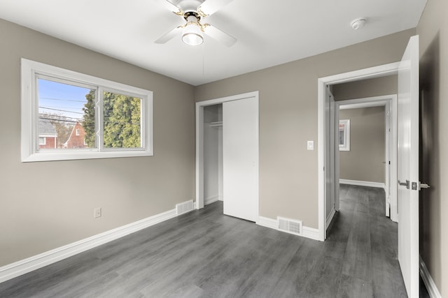 15167 Keppen Ave, Allen Park, MI 48101 - unfurnished bedroom with visible vents, baseboards, dark wood-type flooring, and a closet