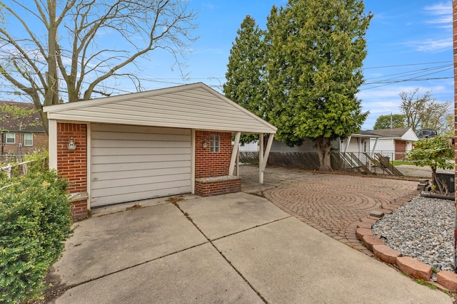 15167 Keppen Ave, Allen Park, MI 48101 - detached garage featuring concrete driveway and fence