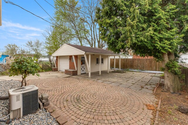 15167 Keppen Ave, Allen Park, MI 48101 - exterior space featuring a garage, central AC, an outbuilding, and fence