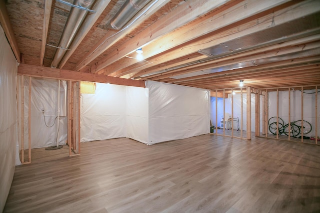 unfinished basement with wood finished floors