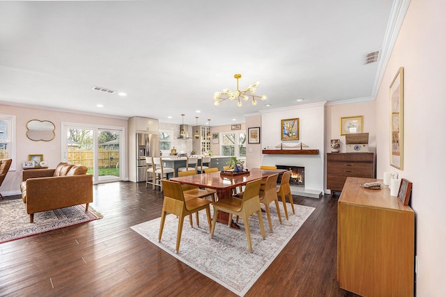 dining area with crown molding, recessed lighting, a notable chandelier, and visible vents