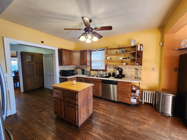 kitchen featuring open shelves, radiator, black microwave, wooden counters, and dishwasher