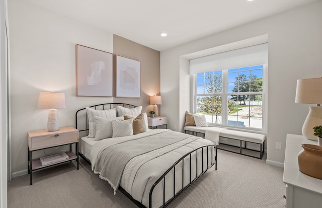 carpeted bedroom featuring recessed lighting and baseboards