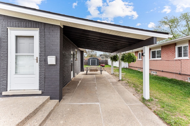 exterior space featuring an outbuilding and a storage unit