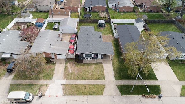 birds eye view of property with a residential view