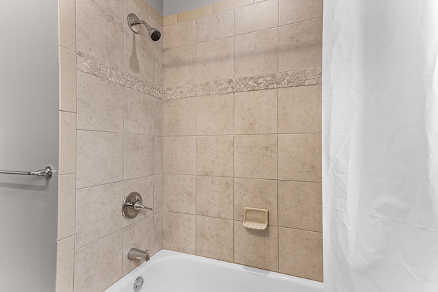 bathroom featuring shower / bath combo with shower curtain