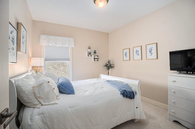 bedroom featuring baseboards and carpet floors