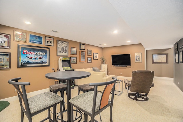 dining area featuring visible vents, recessed lighting, and light carpet
