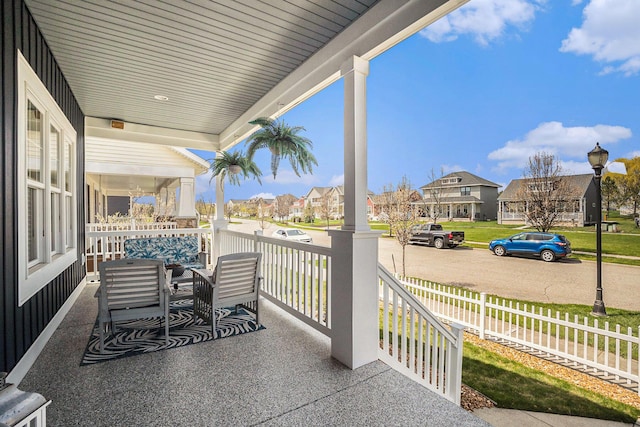 view of patio / terrace featuring covered porch and a residential view