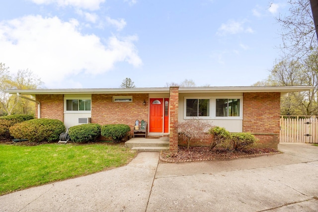 5009 John Holmes Rd, Ann Arbor, MI 48103 - view of front of home with brick siding and a front lawn