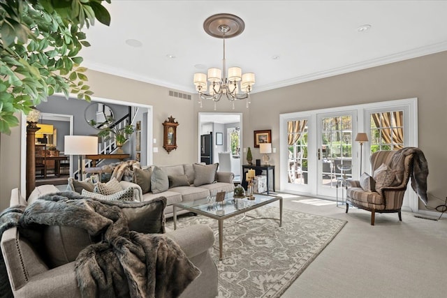 carpeted living room featuring a chandelier, crown molding, and french doors