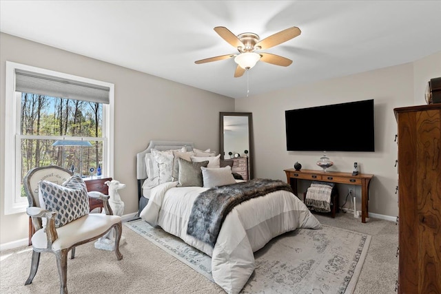 bedroom with carpet floors, baseboards, and ceiling fan