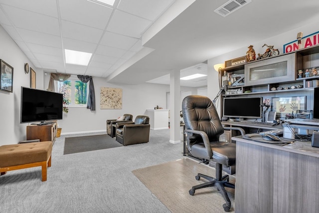 home office featuring carpet, visible vents, a drop ceiling, and baseboards