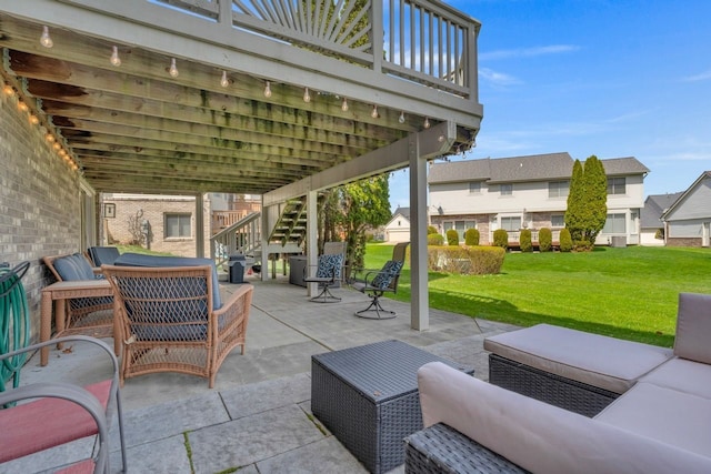 view of patio / terrace with an outdoor living space, a residential view, and stairs