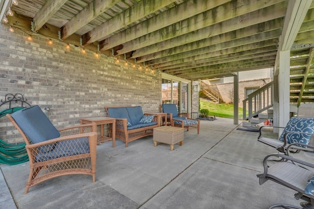 view of patio with stairway and an outdoor hangout area