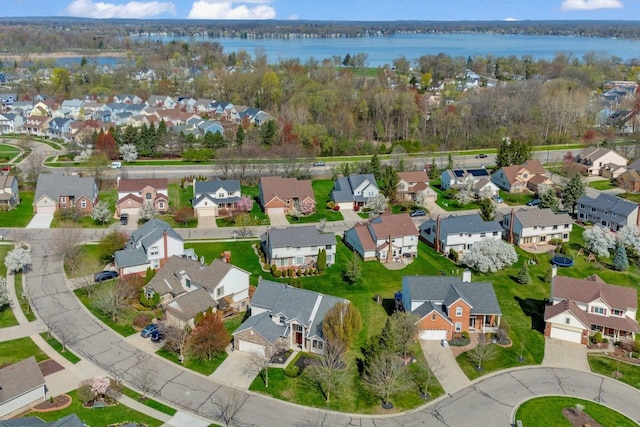 birds eye view of property featuring a residential view and a water view