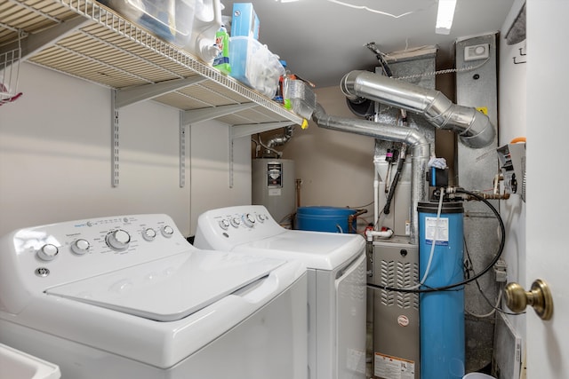 61161 Greenwood Dr, South Lyon, MI 48178 - laundry room with separate washer and dryer, laundry area, and water heater