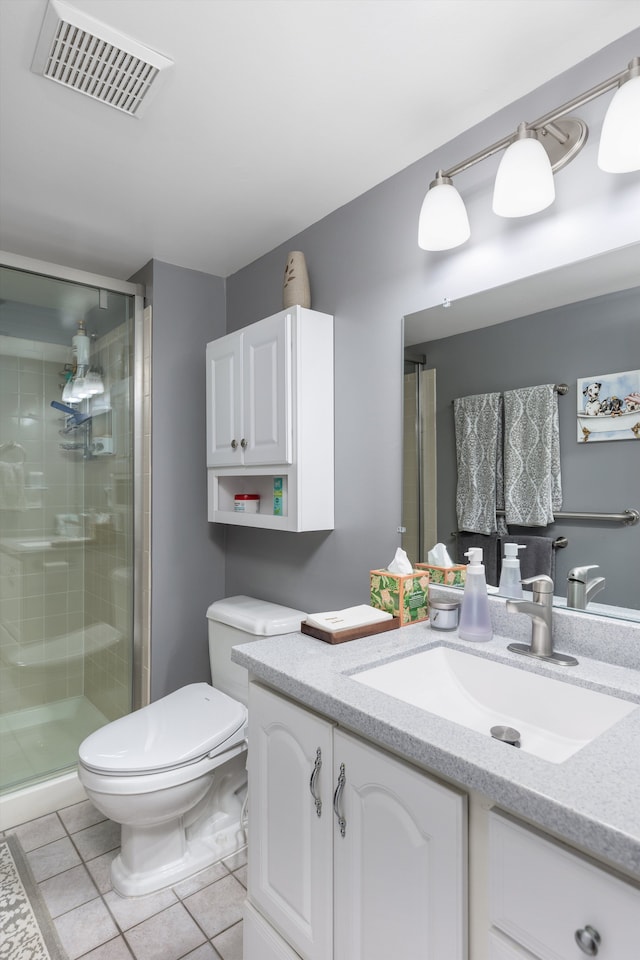 61161 Greenwood Dr, South Lyon, MI 48178 - bathroom with visible vents, vanity, toilet, tile patterned floors, and a shower stall