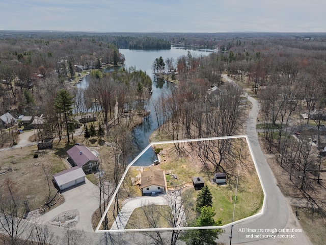 aerial view with a water view and a forest view